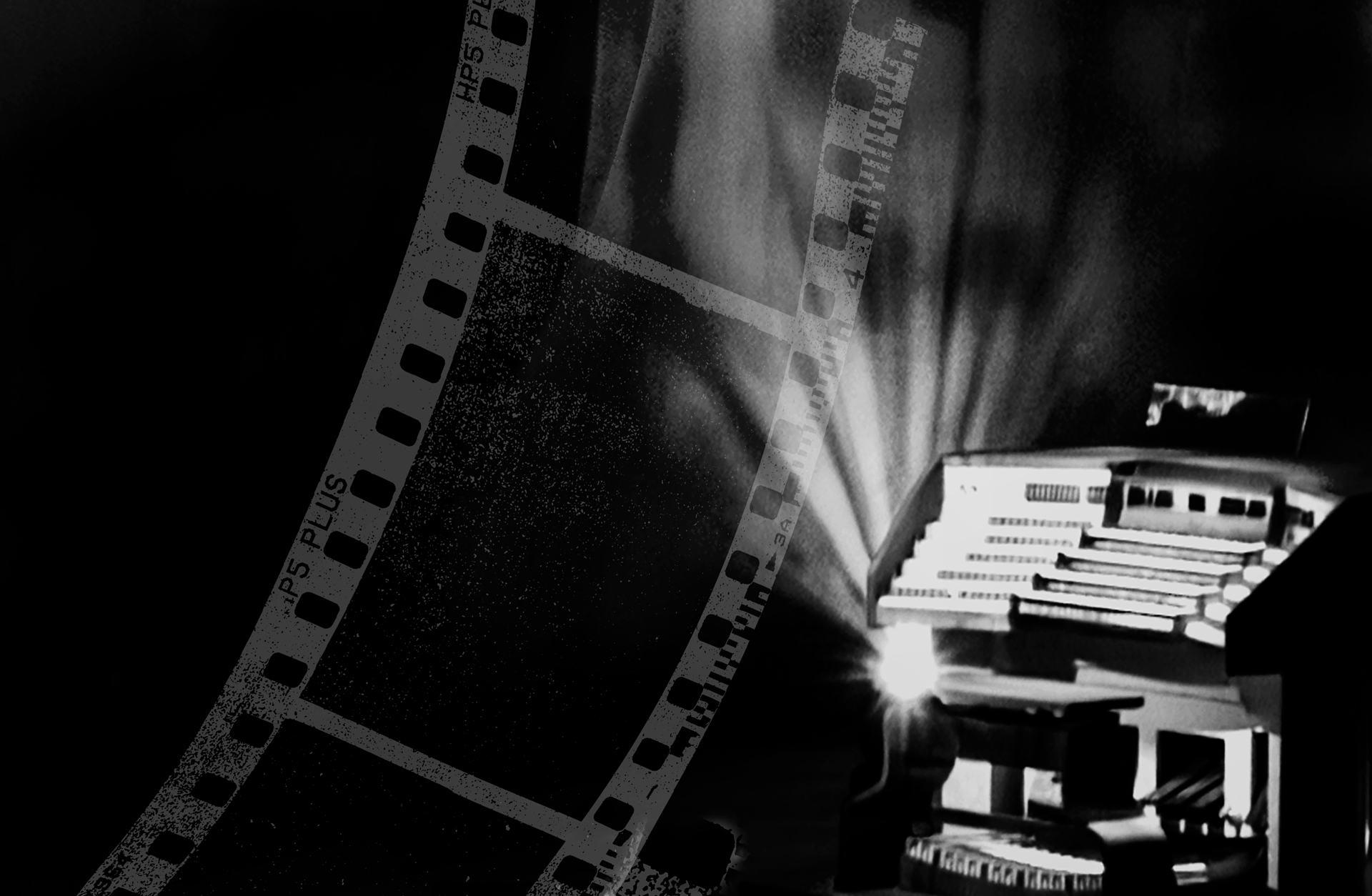 Svartvit bild av ett orgelspelbord och en gammeldags filmremsa.